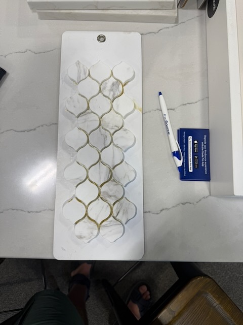 Arabesque / lantern-form marble mosaic, warm white with gold veining